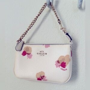 Coach floral leather wristlet in like new condition.